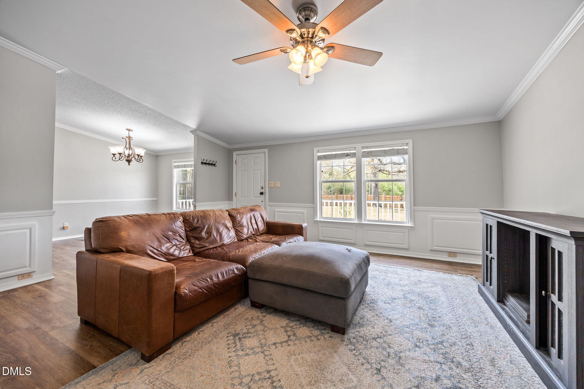 1659 Adcock Road Lillington, NC 27546 - Photo 5 of 34 a living room with furniture and a flat screen tv