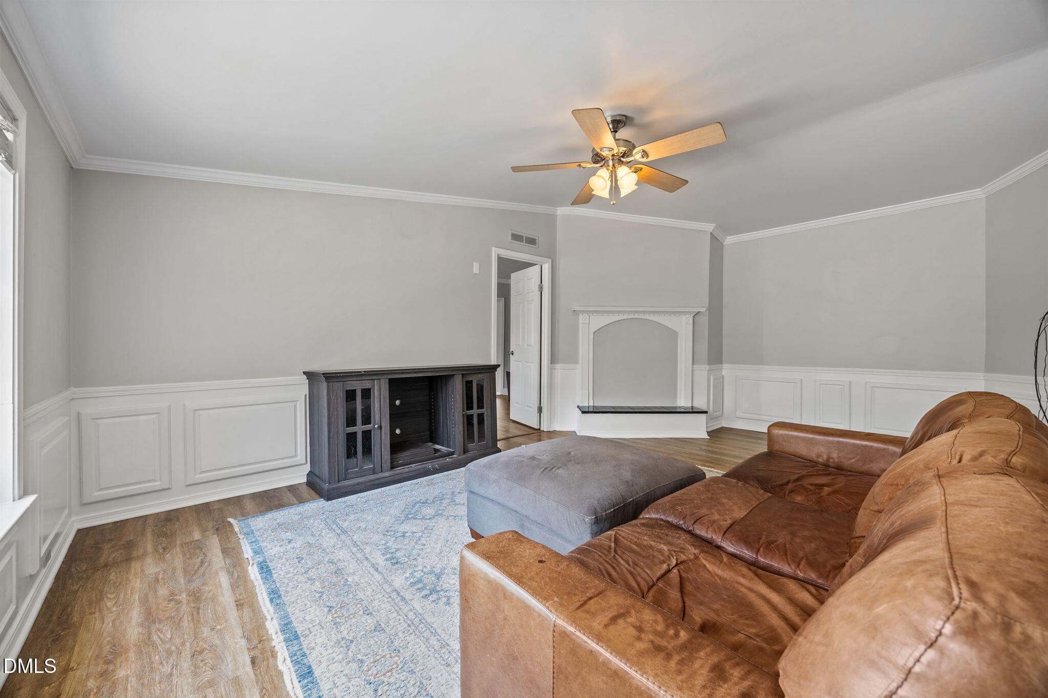 1659 Adcock Road Lillington, NC 27546 - Photo 6 of 34 a bed room with a bed and a chandelier