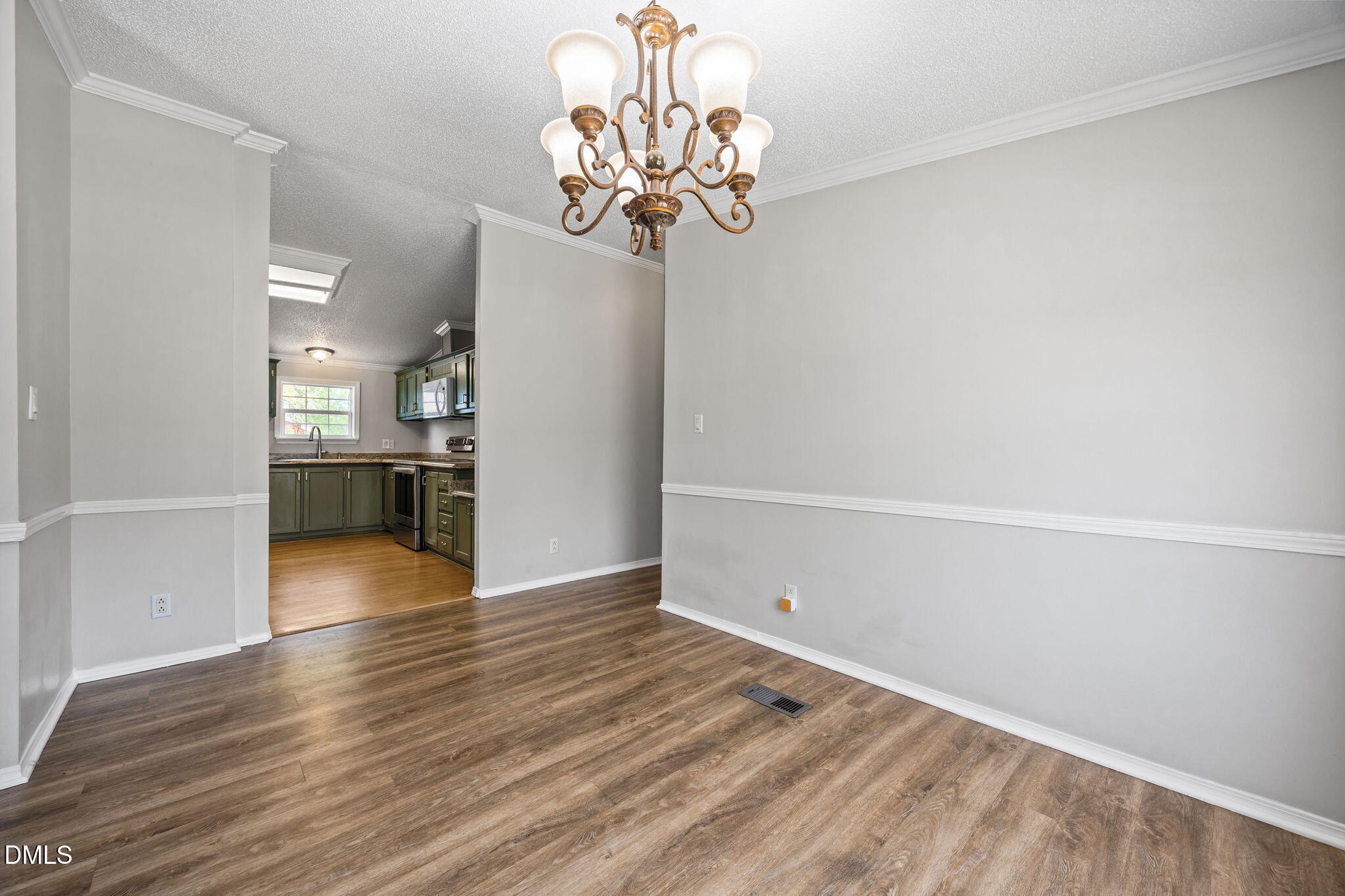 1659 Adcock Road Lillington, NC 27546 - Photo 8 of 34 a view of a room with wooden floor and a large window
