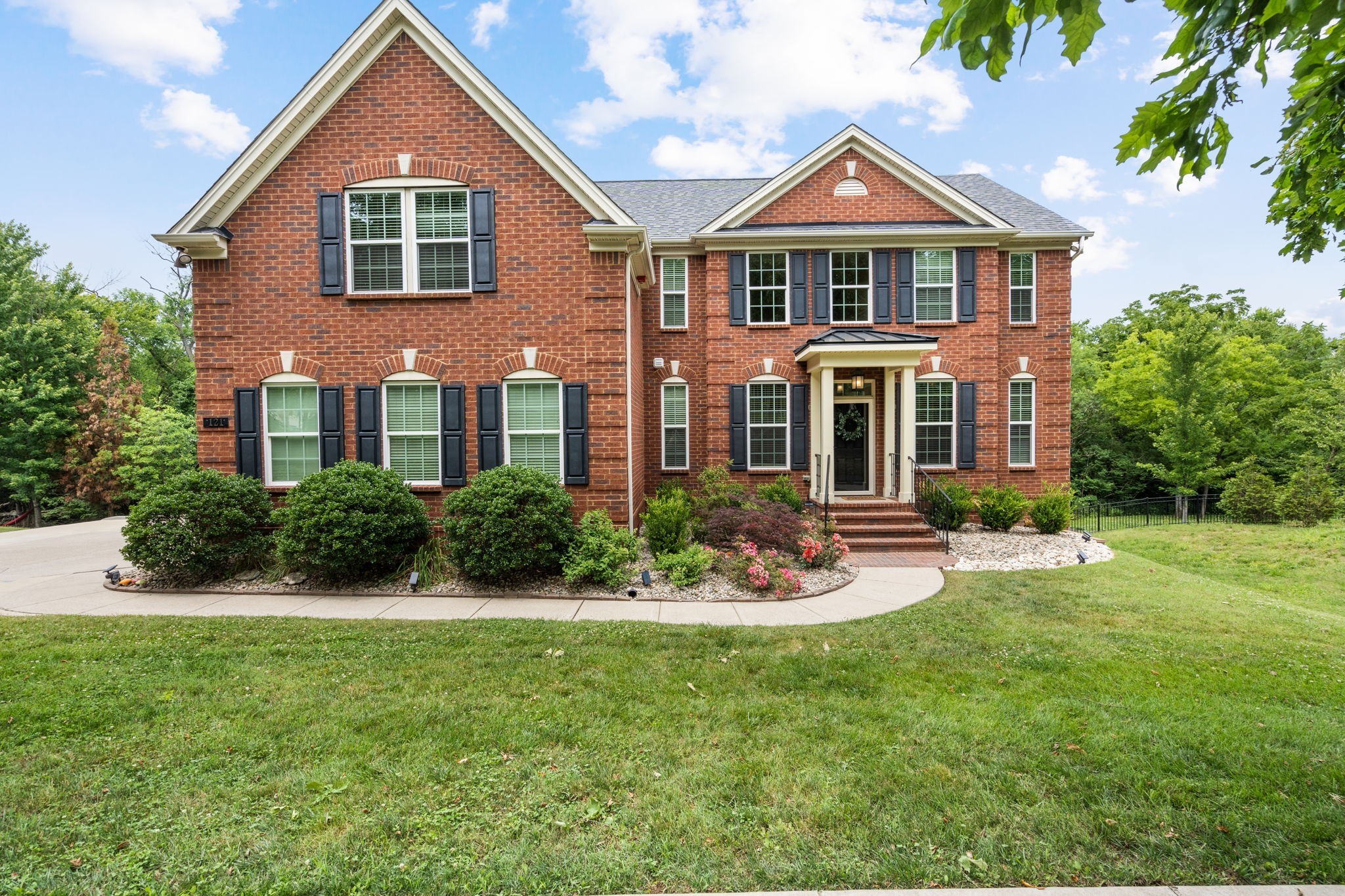 121 Stream Valley Boulevard Franklin, TN 37064 - Photo 2 of 60 a front view of a house with a yard