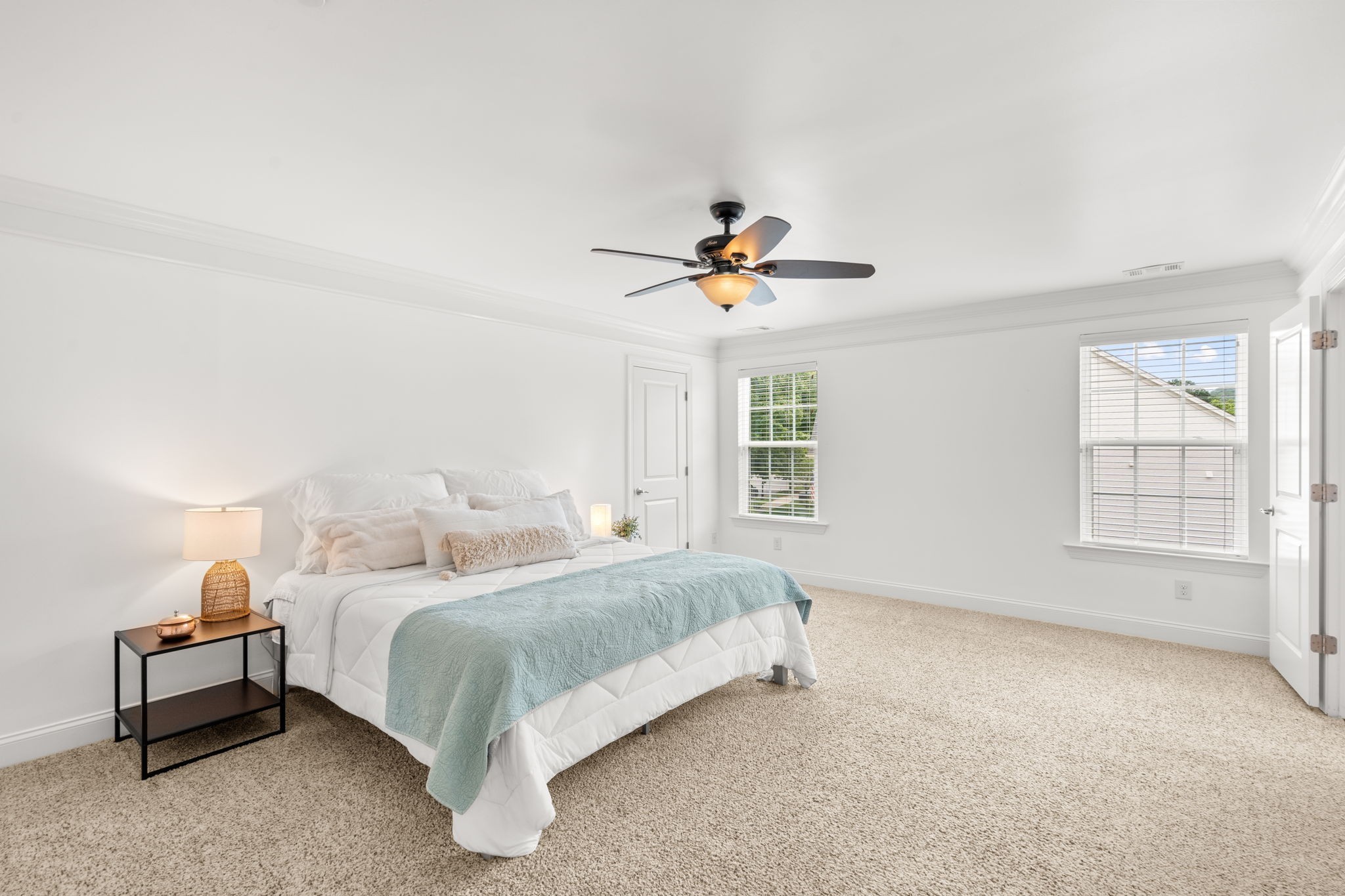 121 Stream Valley Boulevard Franklin, TN 37064 - Photo 24 of 60 a bedroom with a bed and a chandelier