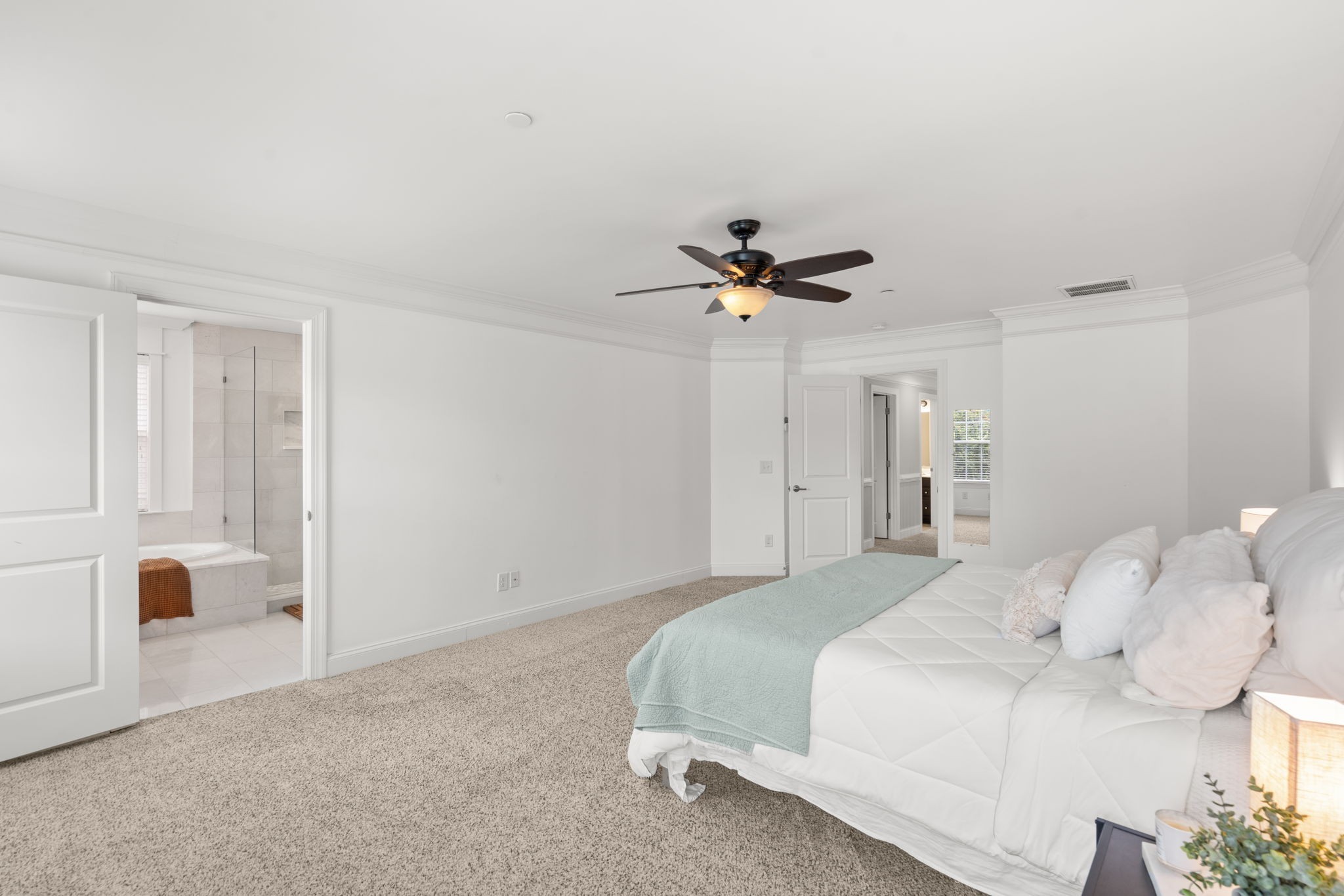 121 Stream Valley Boulevard Franklin, TN 37064 - Photo 25 of 60 a bedroom with a bed and a chandelier