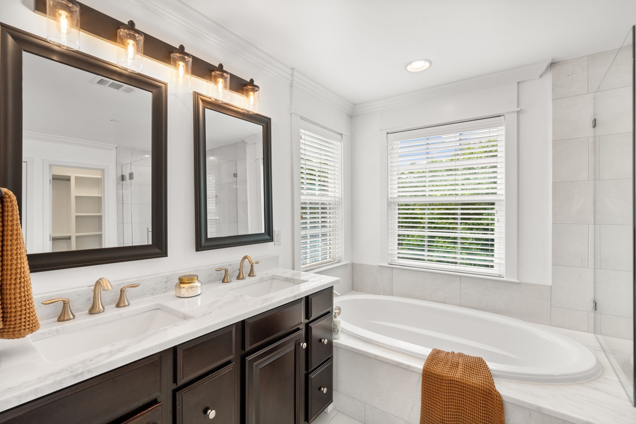 121 Stream Valley Boulevard Franklin, TN 37064 - Photo 26 of 60 a bathroom with a tub double sink and a mirror