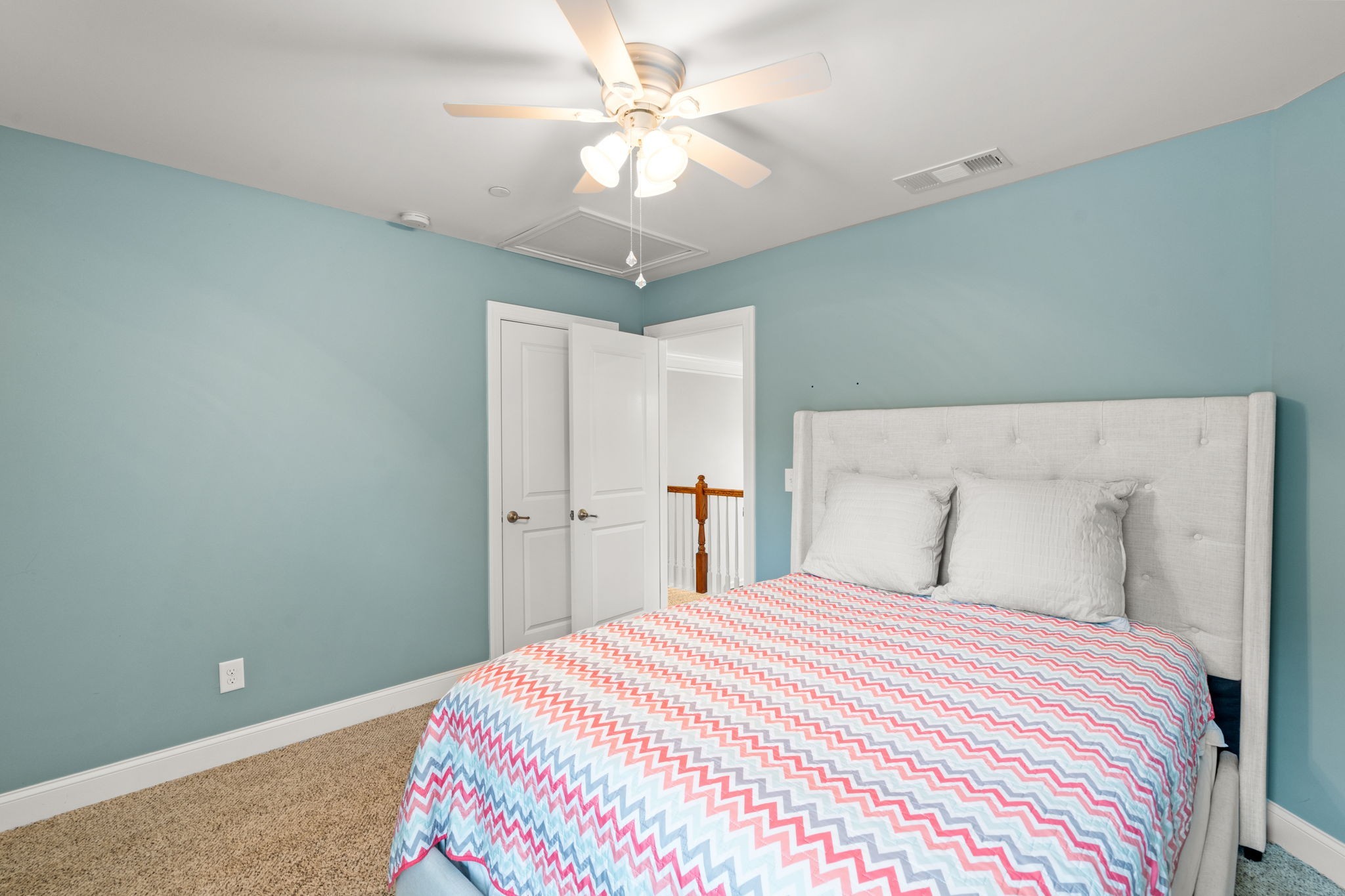 121 Stream Valley Boulevard Franklin, TN 37064 - Photo 31 of 60 a bedroom with a bed and a chandelier