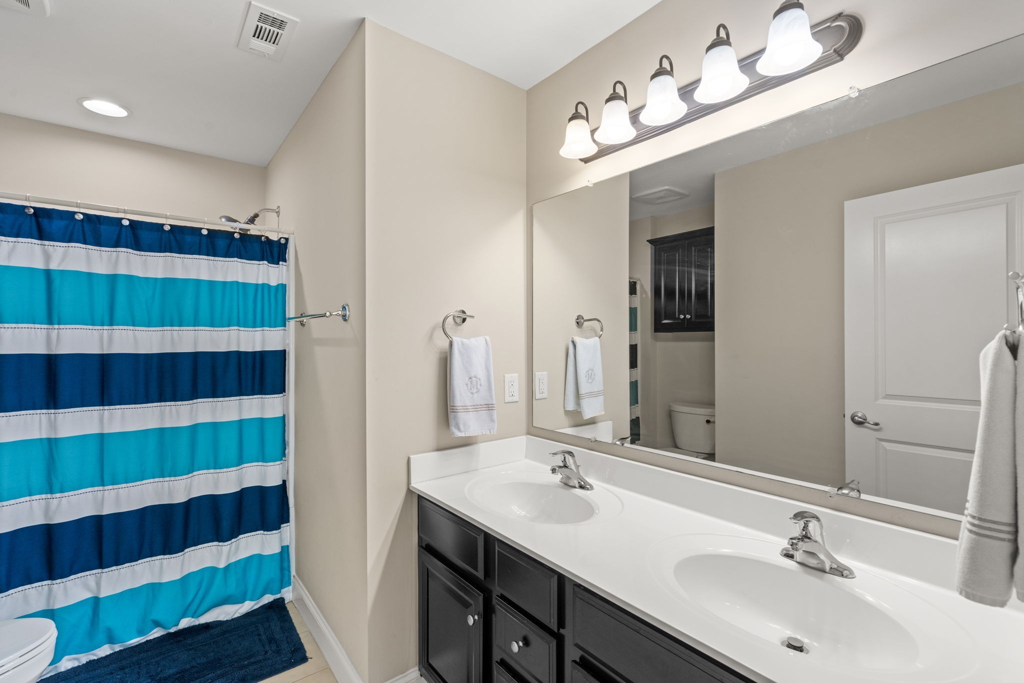 121 Stream Valley Boulevard Franklin, TN 37064 - Photo 32 of 60 a bathroom with a sink double vanity and a mirror