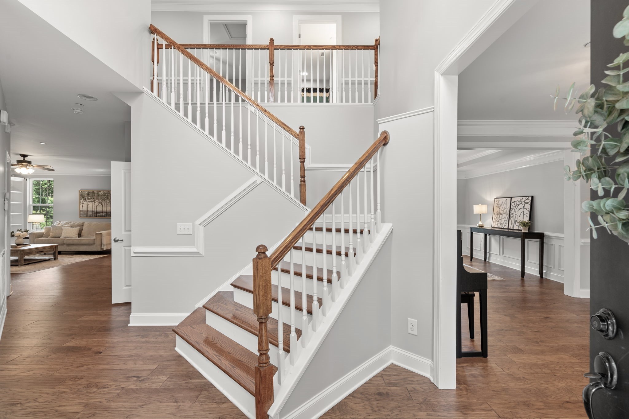 121 Stream Valley Boulevard Franklin, TN 37064 - Photo 6 of 60 a view of staircase with lots of frames and couches