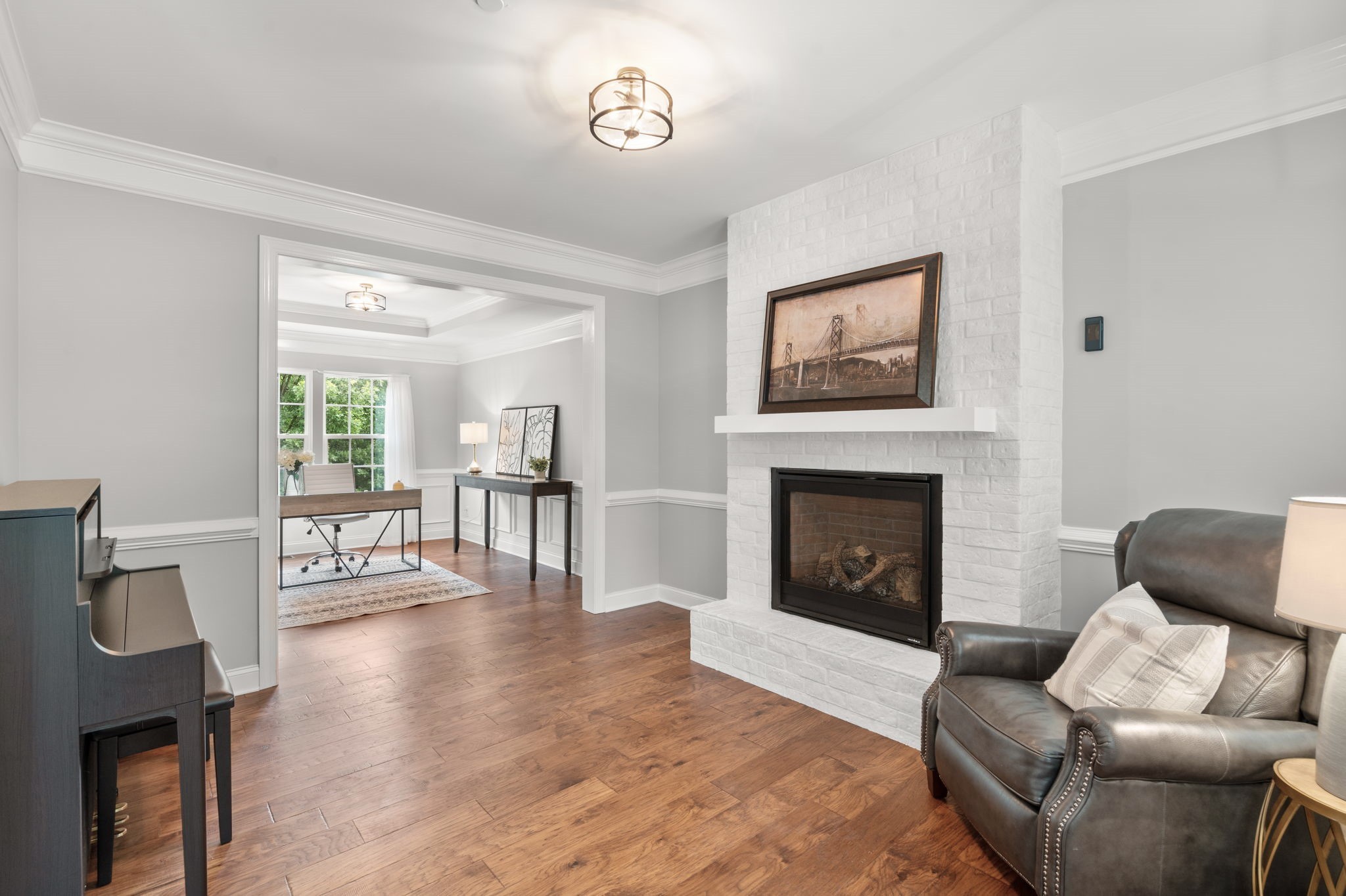 121 Stream Valley Boulevard Franklin, TN 37064 - Photo 7 of 60 a living room with furniture and a fireplace
