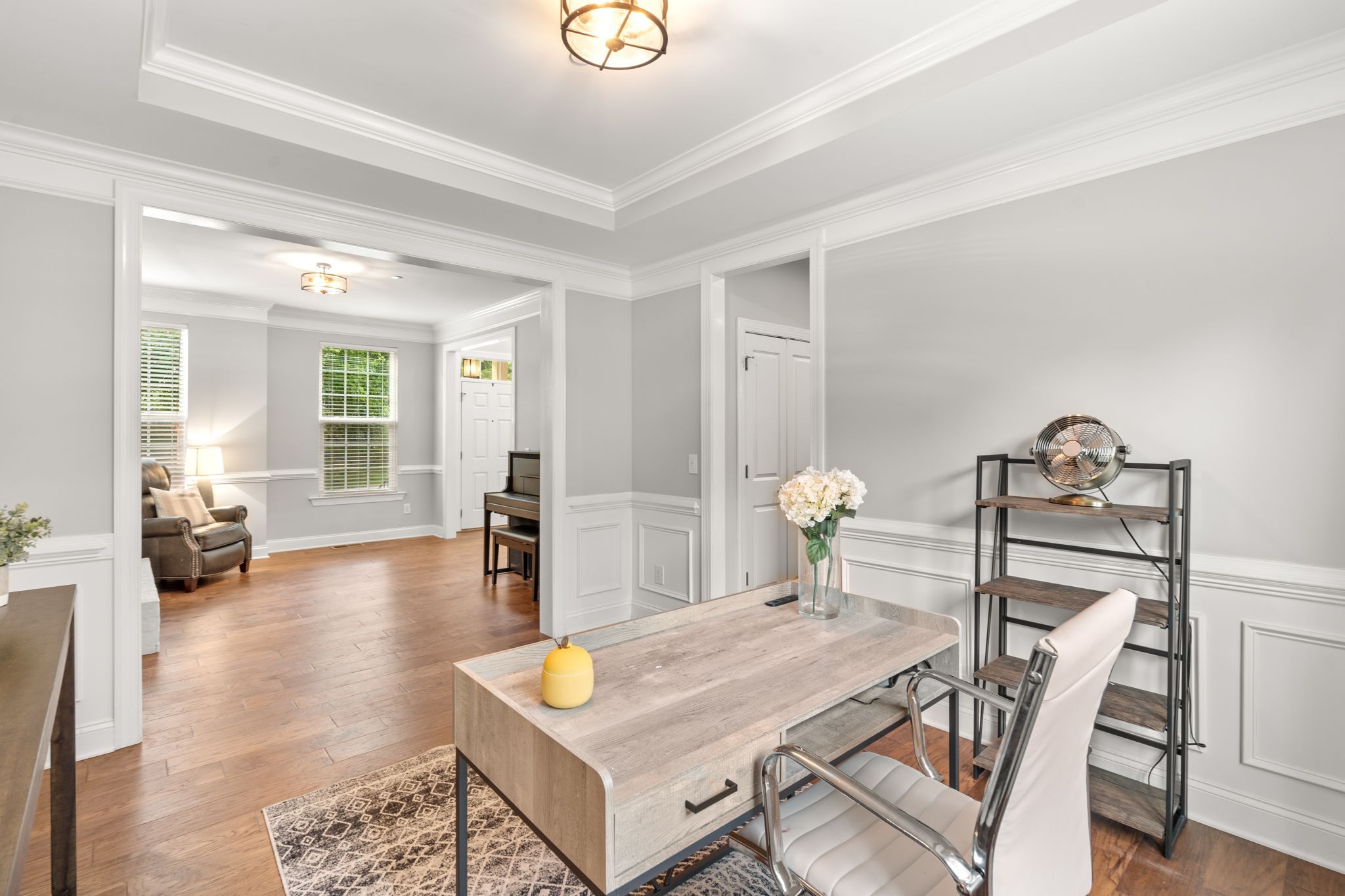 121 Stream Valley Boulevard Franklin, TN 37064 - Photo 9 of 60 a living room with furniture a table and wooden floor