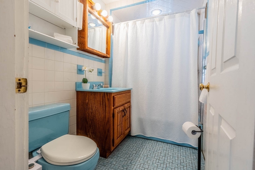 51 Edwin Road Waltham, MA 02453 - Photo 12 of 35 a bathroom with a toilet a sink and shower