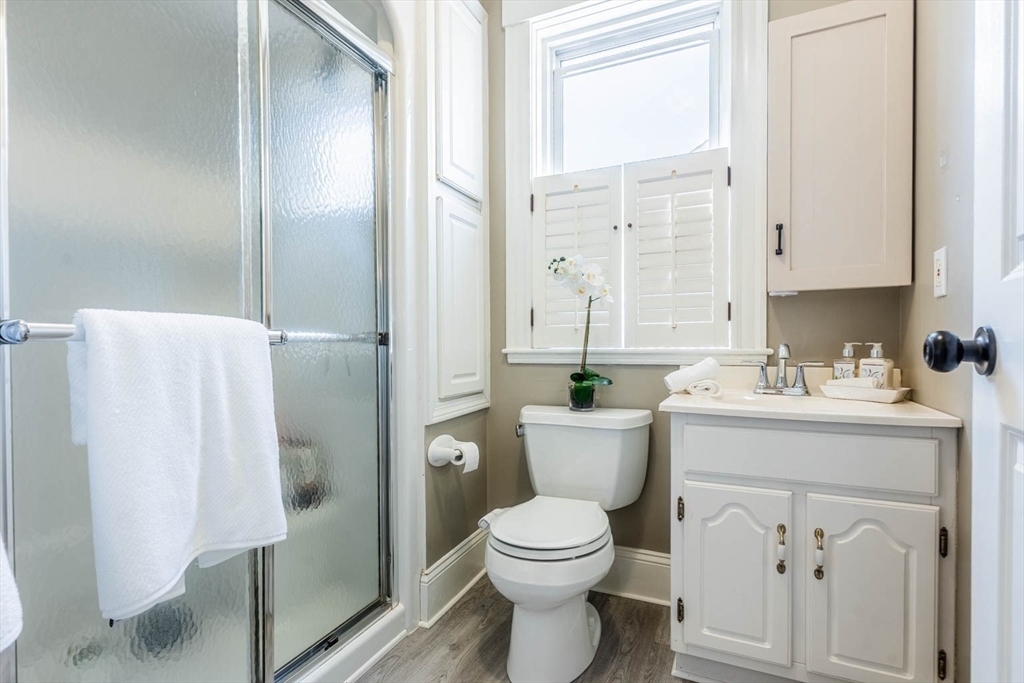 51 Edwin Road Waltham, MA 02453 - Photo 13 of 35 a bathroom with a toilet sink and shower