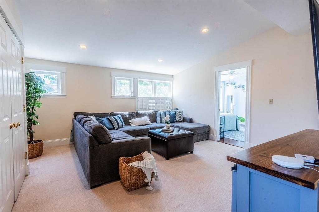 51 Edwin Road Waltham, MA 02453 - Photo 15 of 35 a living room with furniture and a potted plant