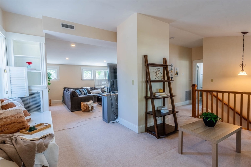 51 Edwin Road Waltham, MA 02453 - Photo 18 of 35 a living room with furniture and a flat screen tv