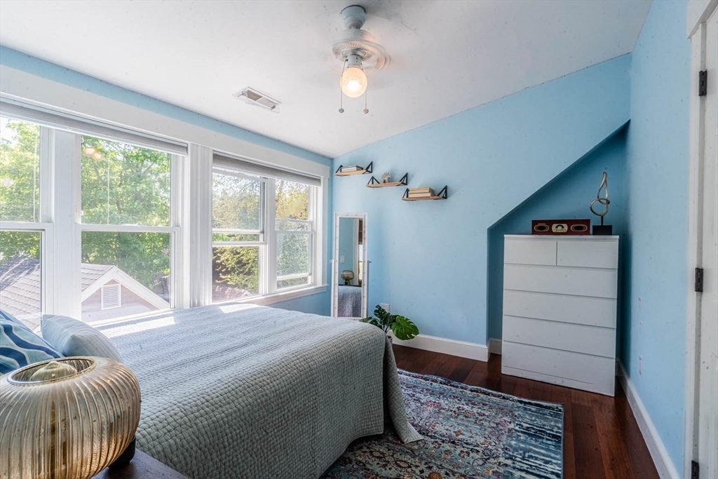 51 Edwin Road Waltham, MA 02453 - Photo 20 of 35 a bedroom with a bed and large windows