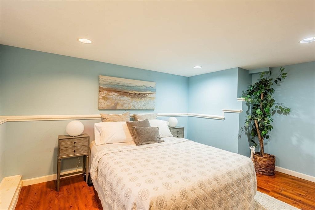 51 Edwin Road Waltham, MA 02453 - Photo 24 of 35 a bedroom with a bed and a potted plant