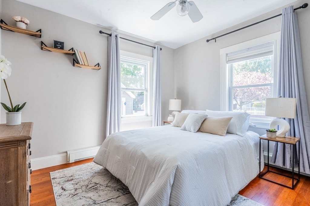 51 Edwin Road Waltham, MA 02453 - Photo 25 of 35 a bedroom with a bed a dresser and a window