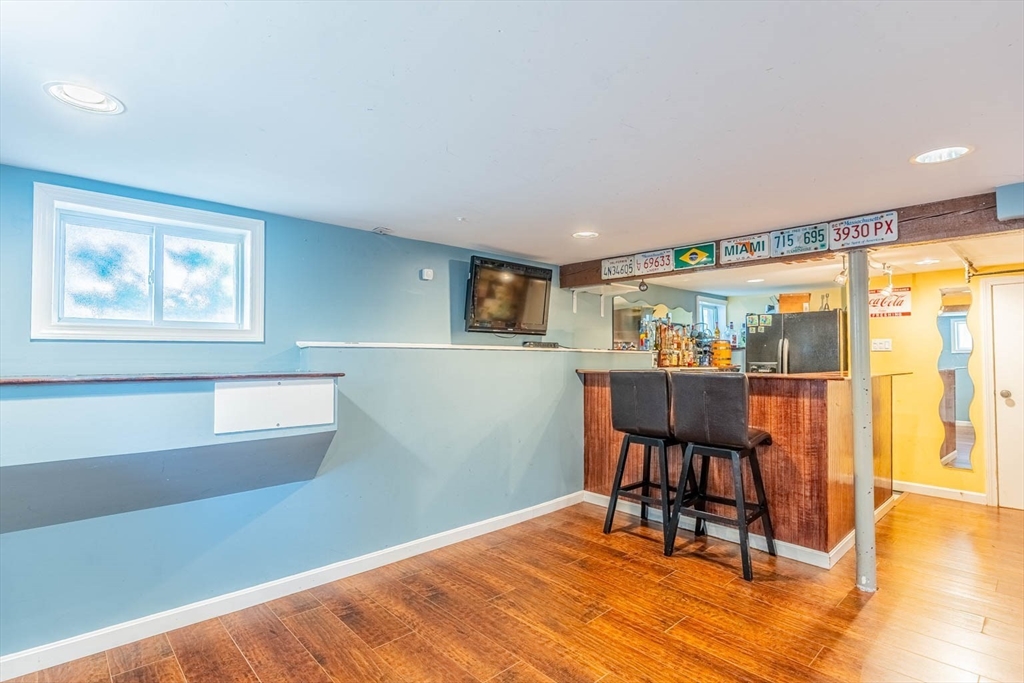 51 Edwin Road Waltham, MA 02453 - Photo 28 of 35 a dining room with furniture and wooden floor