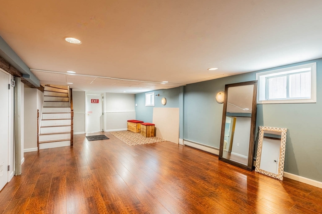 51 Edwin Road Waltham, MA 02453 - Photo 29 of 35 a view of an empty room with wooden floor and a window