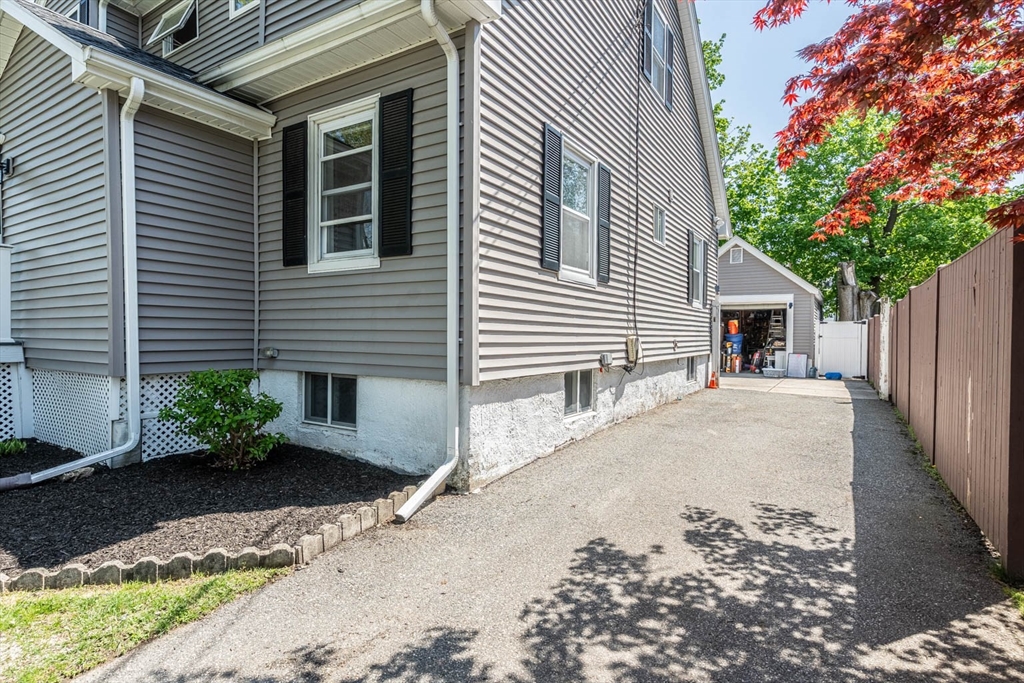 51 Edwin Road Waltham, MA 02453 - Photo 30 of 35 a house with a yard and a outdoor seating