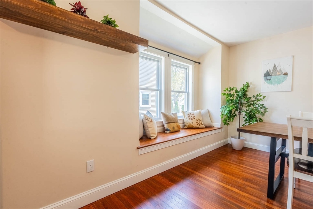 51 Edwin Road Waltham, MA 02453 - Photo 7 of 35 a room with wooden floor and furniture