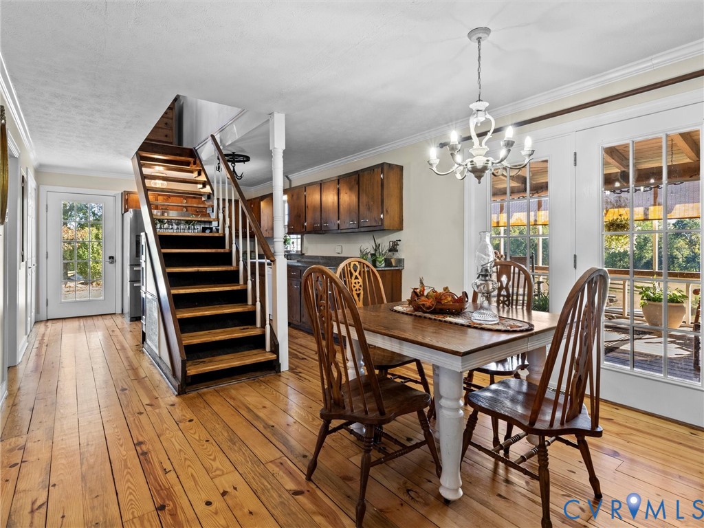 1024 Back Mountain Road Dillwyn, VA 23936 - Photo 22 of 70 a view of a dining room with furniture wooden floor and chandelier