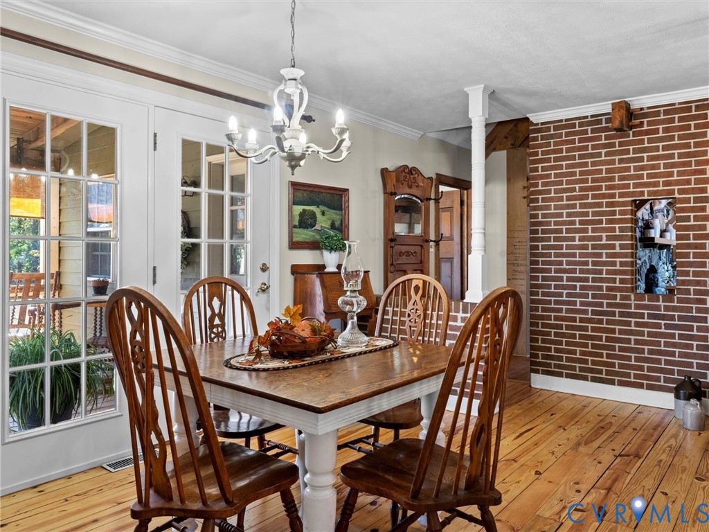 1024 Back Mountain Road Dillwyn, VA 23936 - Photo 25 of 70 a view of a dining room with furniture window and wooden floor