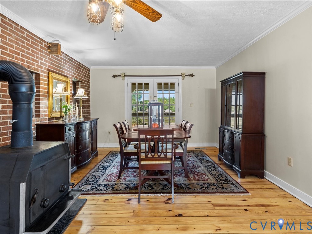1024 Back Mountain Road Dillwyn, VA 23936 - Photo 27 of 70 a dining room with furniture a rug and wooden floor