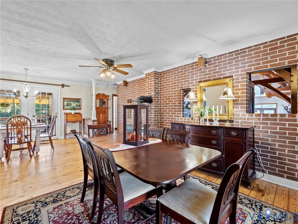 1024 Back Mountain Road Dillwyn, VA 23936 - Photo 29 of 70 a dining room with furniture and wooden floor