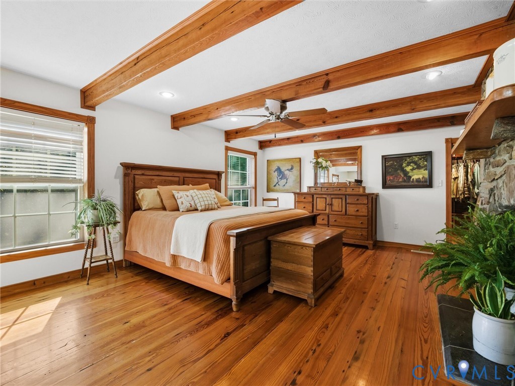 1024 Back Mountain Road Dillwyn, VA 23936 - Photo 30 of 70 a bedroom with a bed and wooden floor