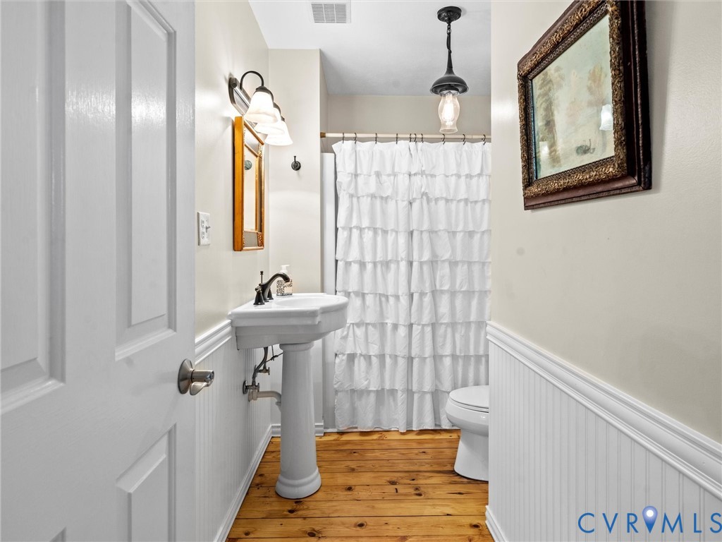 1024 Back Mountain Road Dillwyn, VA 23936 - Photo 38 of 70 a bathroom with a sink a mirror and a shower