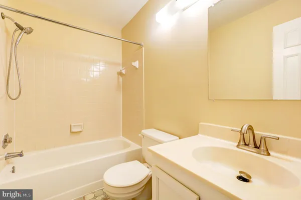 a bathroom with a sink a toilet and a bathtub