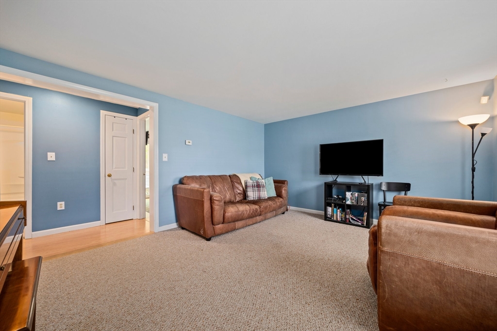 80 King Street Hanover, MA 02339 - Photo 12 of 34 a living room with furniture and a flat screen tv