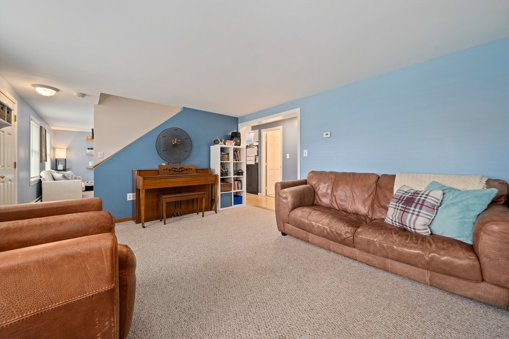 80 King Street Hanover, MA 02339 - Photo 14 of 34 a living room with furniture and a piano