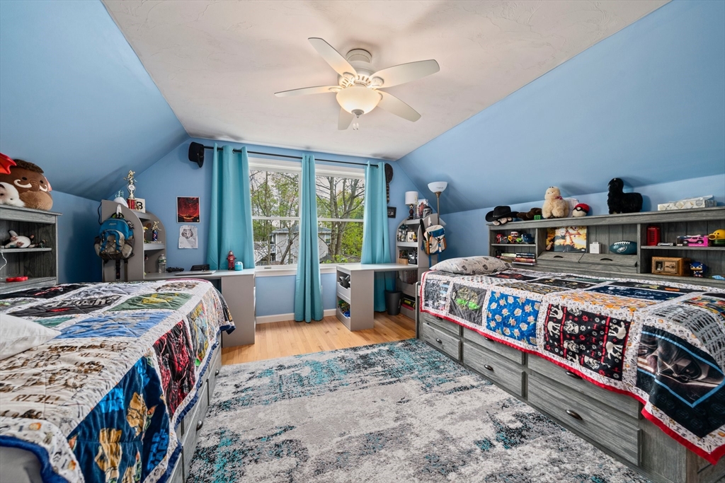 80 King Street Hanover, MA 02339 - Photo 18 of 34 a bed room with a bed a table and a large window