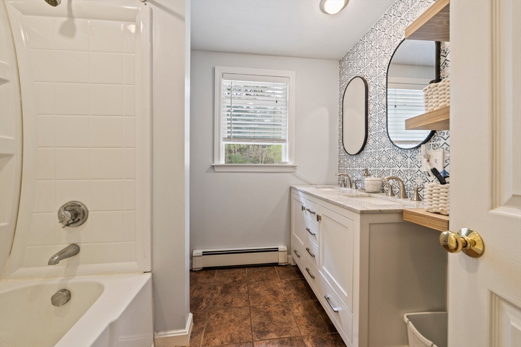 80 King Street Hanover, MA 02339 - Photo 22 of 34 a bathroom with a granite countertop sink mirror and a bathtub