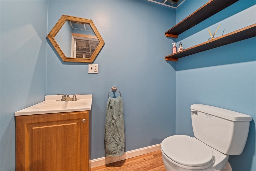 80 King Street Hanover, MA 02339 - Photo 25 of 34 a bathroom with a toilet a sink and mirror