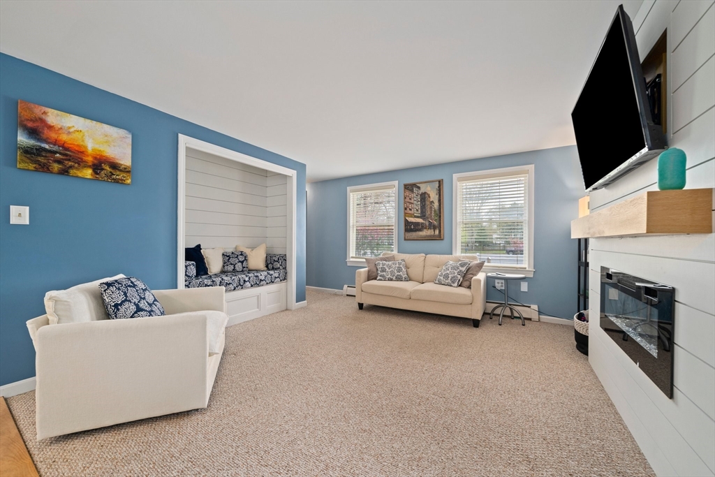 80 King Street Hanover, MA 02339 - Photo 8 of 34 a living room with furniture and a flat screen tv