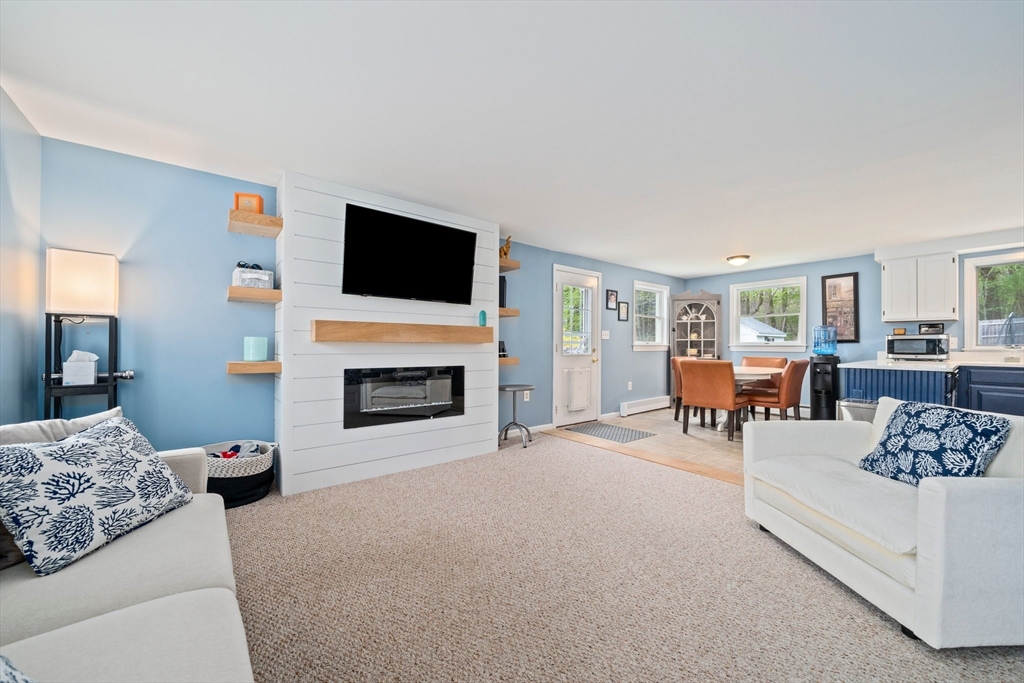 80 King Street Hanover, MA 02339 - Photo 10 of 34 a living room with furniture and a fireplace
