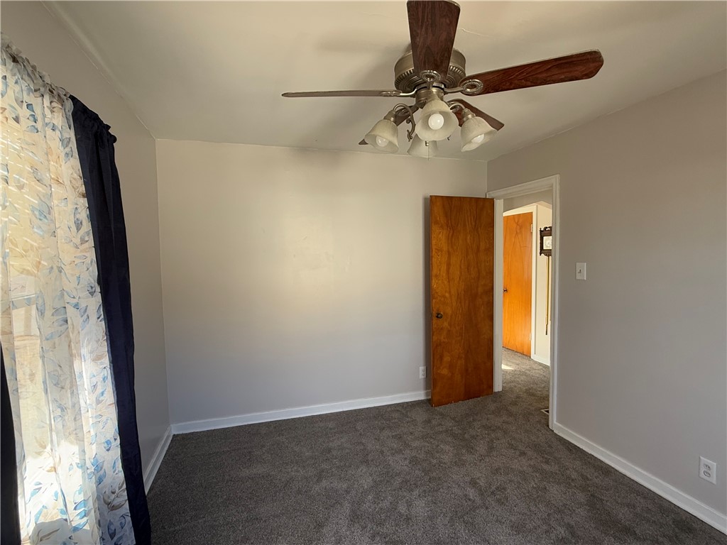955 North McClellan Street Decatur, IL 62522 - Photo 13 of 17 a view of a livingroom with a chandelier fan and a window