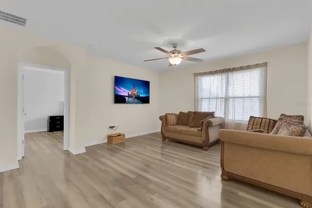 a living room with furniture and a window