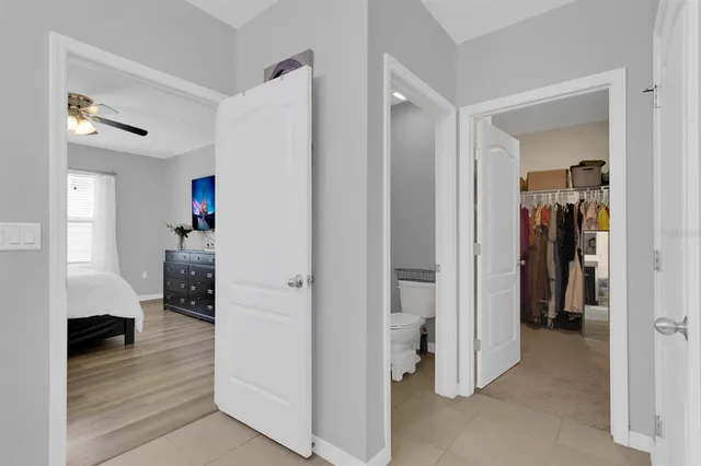 a view of a livingroom and a hallway