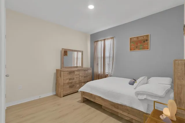 a bedroom with a bed and a cabinets