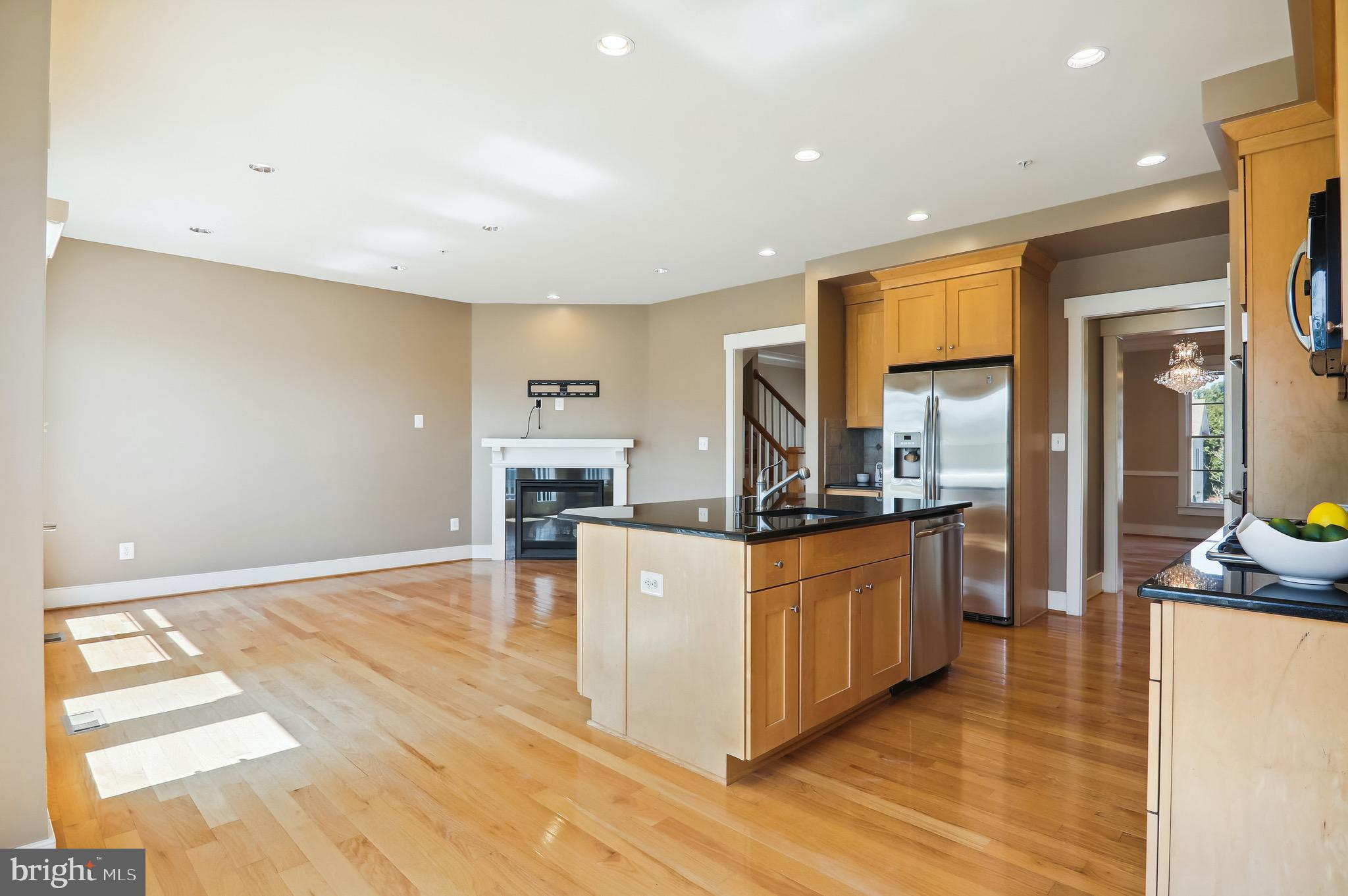 9504 Ament Street Silver Spring, MD 20910 - Photo 3 of 25 Opens to family room with gas fireplace