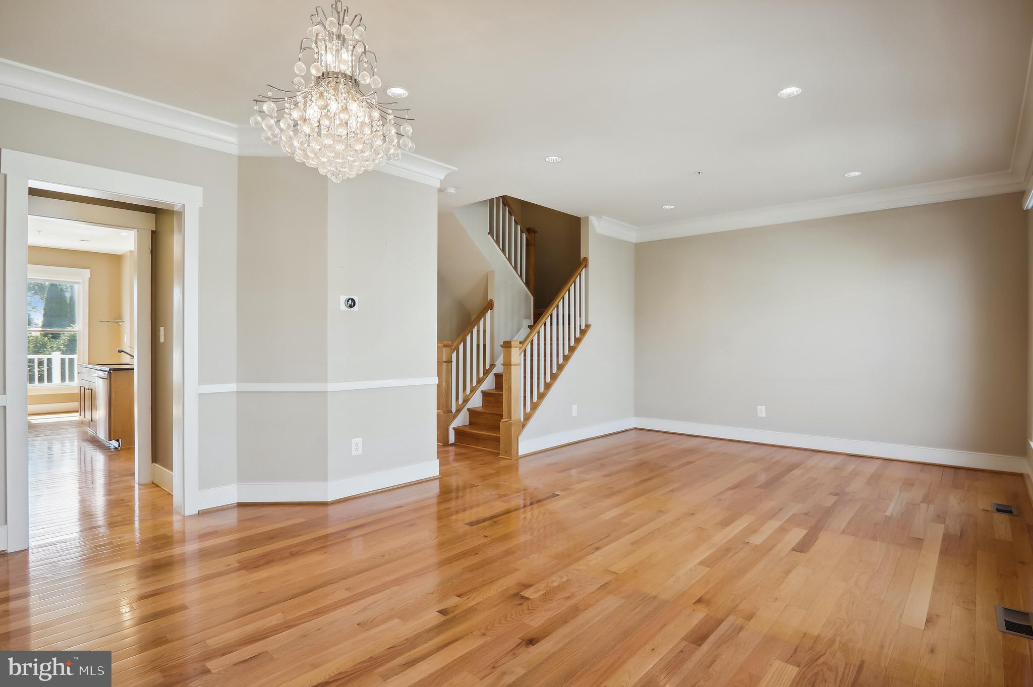 9504 Ament Street Silver Spring, MD 20910 - Photo 5 of 25 Formal dining room with chair and crown moldings