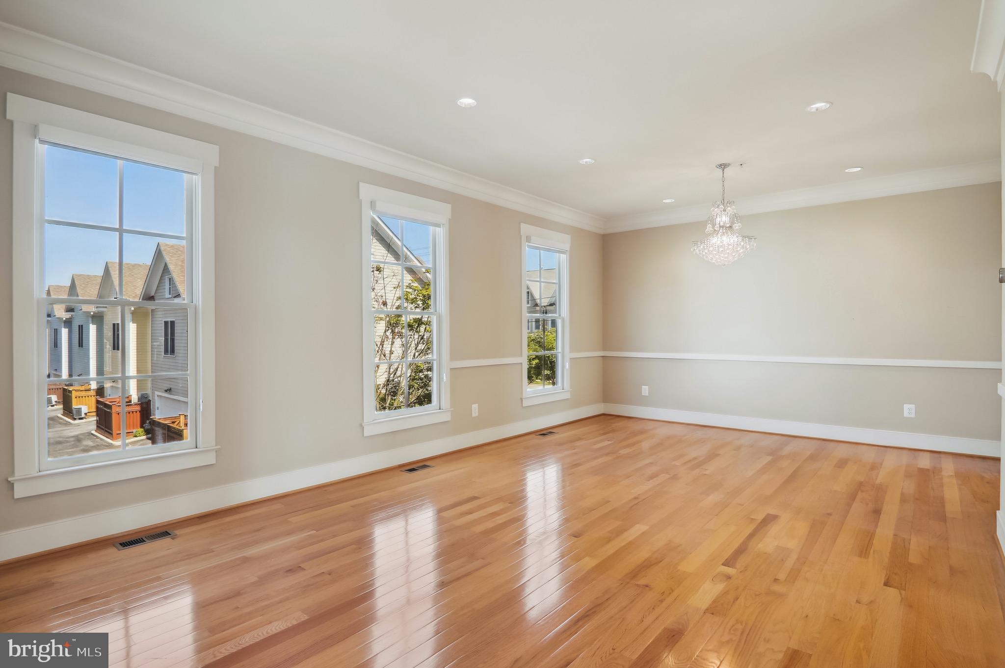 9504 Ament Street Silver Spring, MD 20910 - Photo 7 of 25 Light-filled loving room with crown mouldings