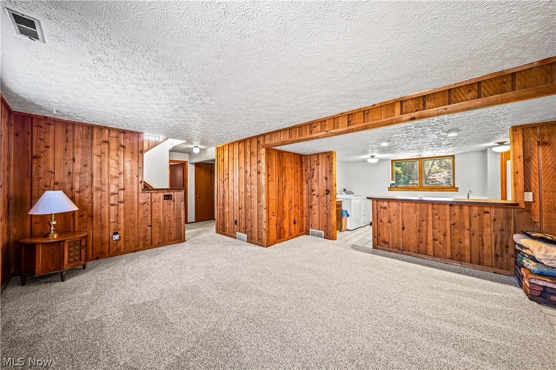 3010 Narrows Road Perry, OH 44081 - Photo 21 of 42 Family room on lower level flowing into laundry/utility room.