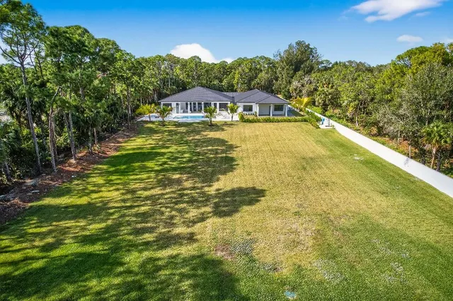a view of a swimming pool with an outdoor space and seating area