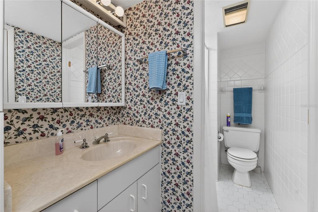 2955 North Beach Road, Unit B614 Englewood, FL 34223 - Photo 32 of 67 a bathroom with a sink toilet and shower