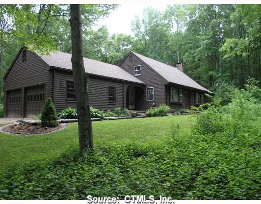 426 Cherry Brook Road Canton, CT 06019 - Photo 1 of 1 a front view of a house with a yard and green space