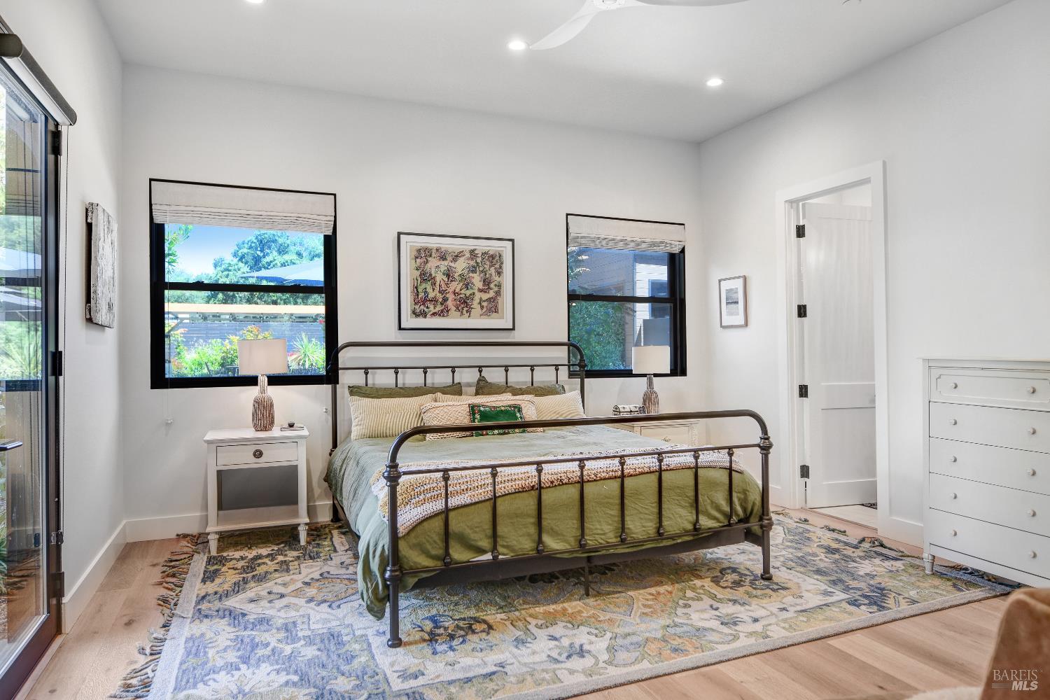85 Trinity Road Glen Ellen, CA 95442 - Photo 25 of 62 a bedroom with a bed a mirror and a dresser