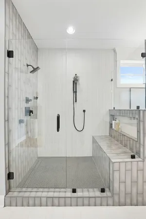 a kitchen with stainless steel appliances kitchen island granite countertop a sink a stove a dining table and chairs